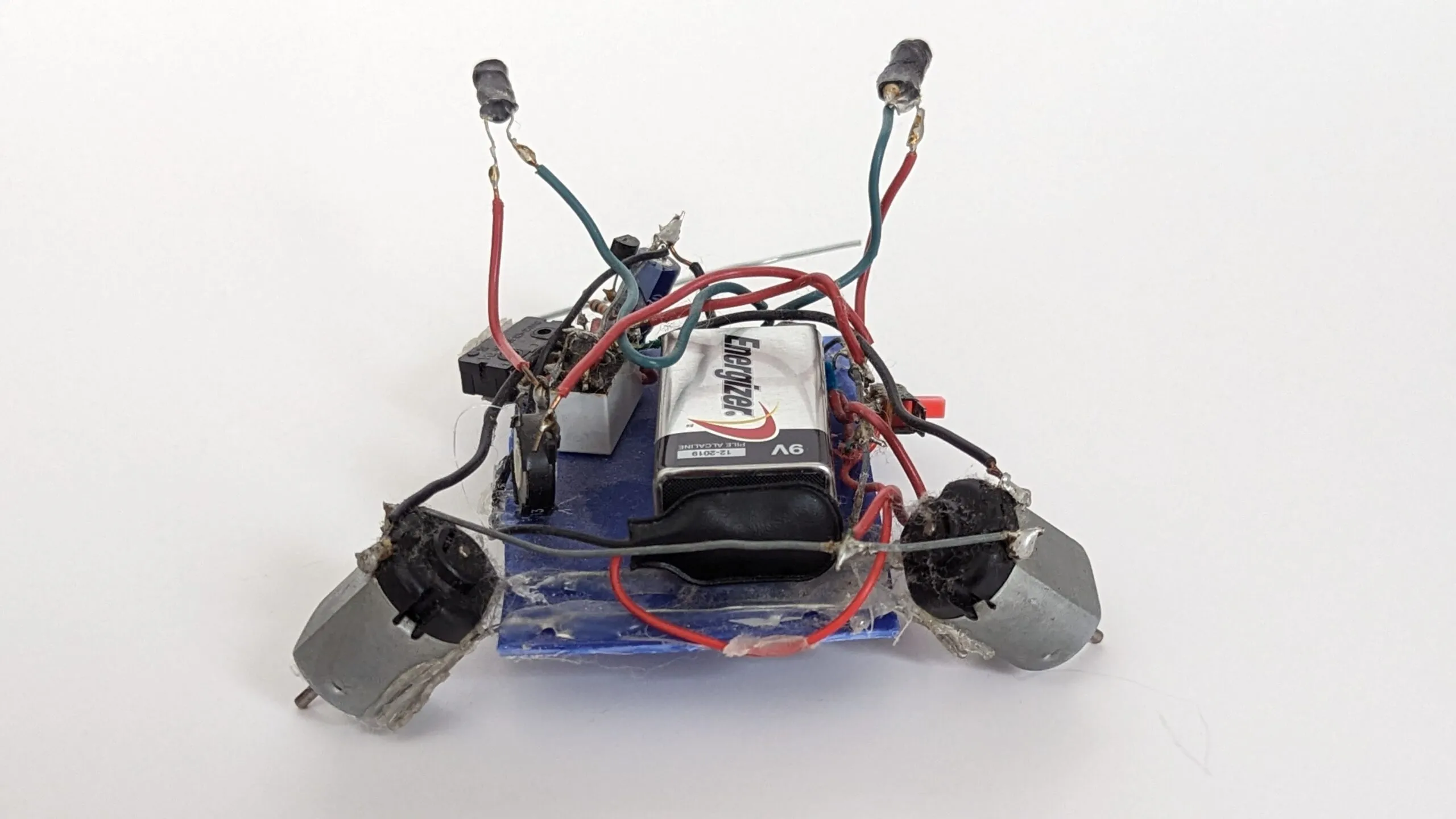 Herbie from behind: photoresistor stalks raised high, drive motors splayed like outriggers.