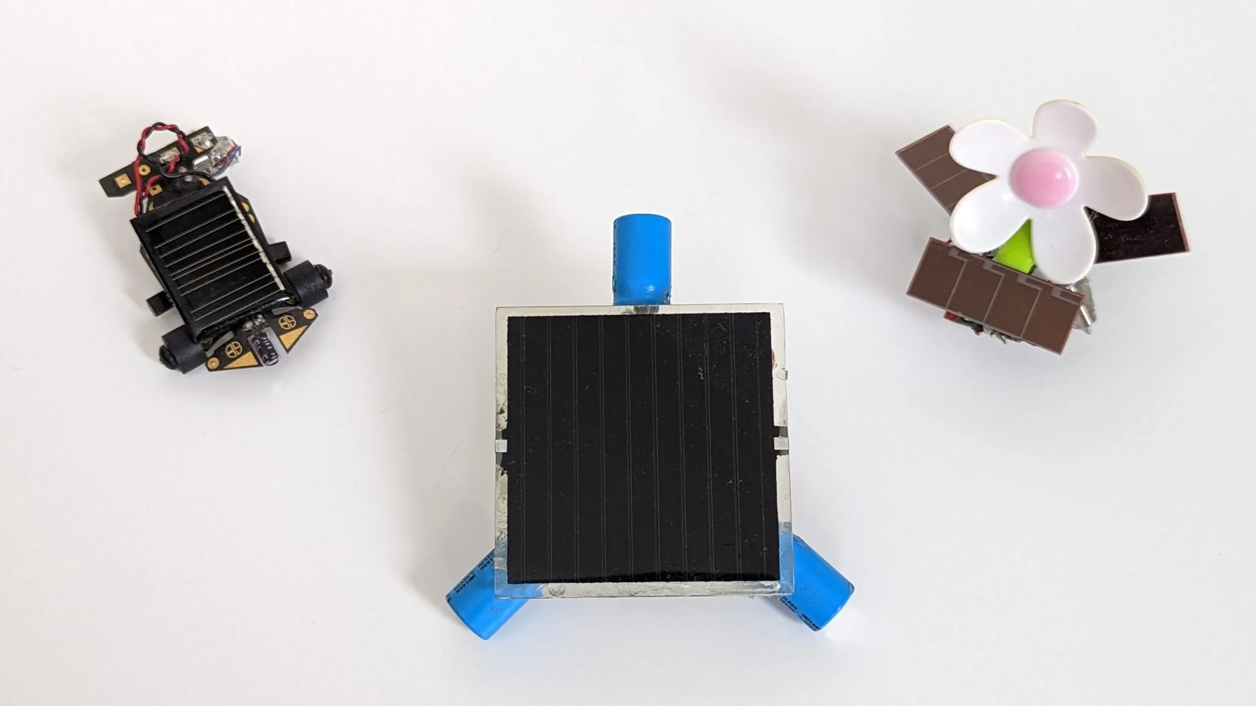 The three solar BEAM robots together: Solar Roller, Symet, and SymFlower.