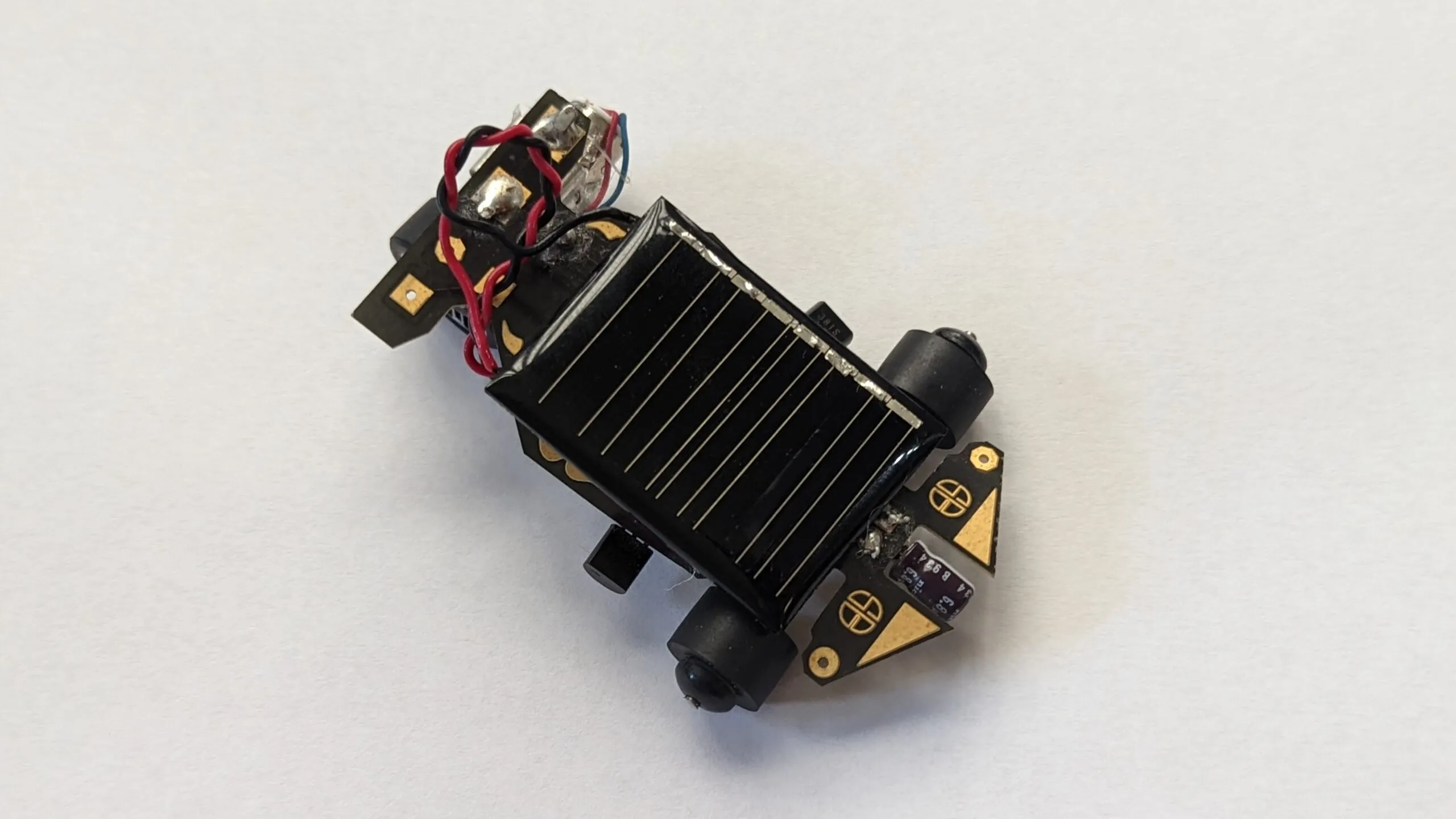 The Solar Roller in 2022: top view with the small solar cell overhanging the PCB chassis.