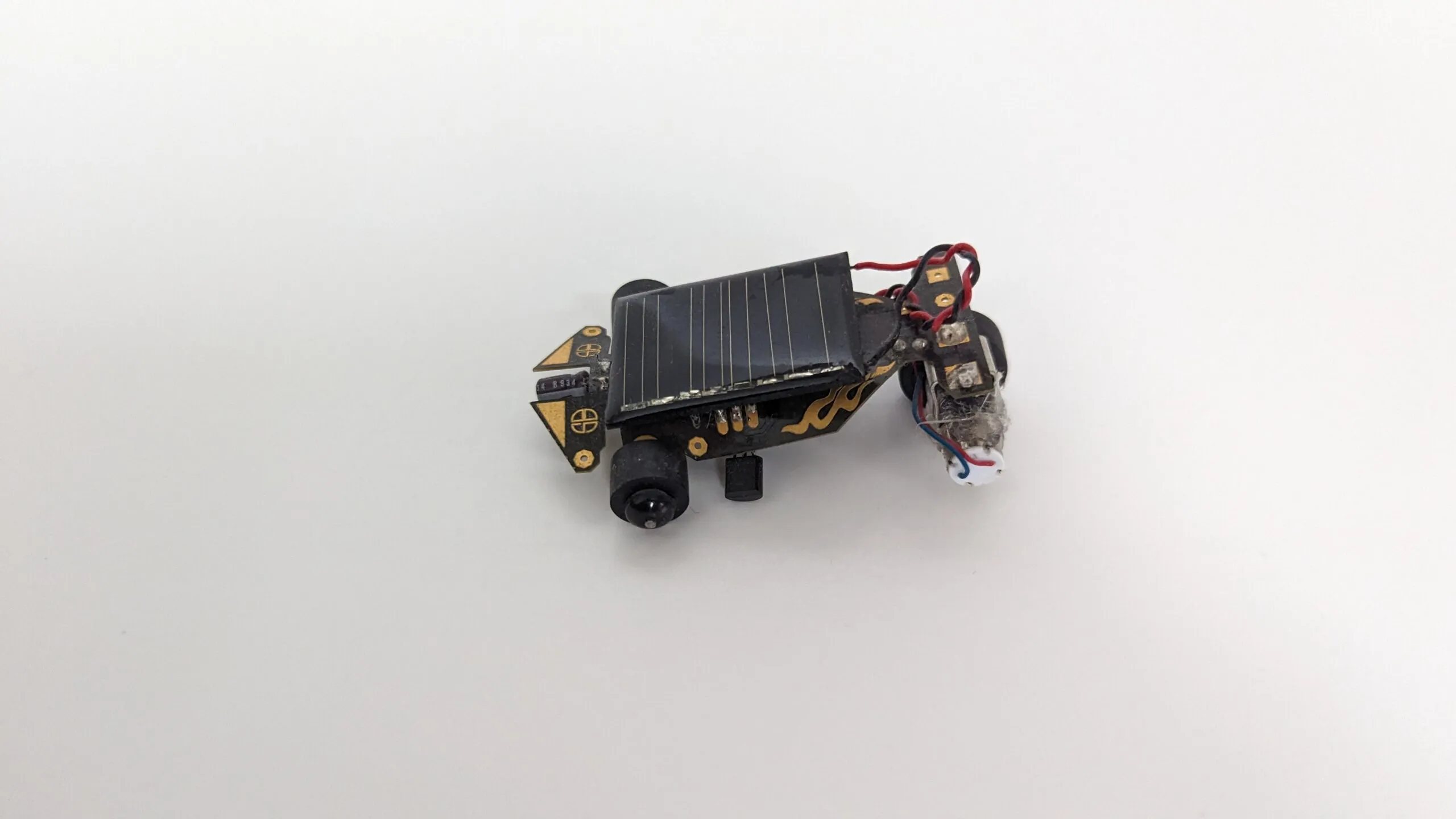 Rear three-quarter view of the Solar Roller, twisted motor leads and a coat of dust.