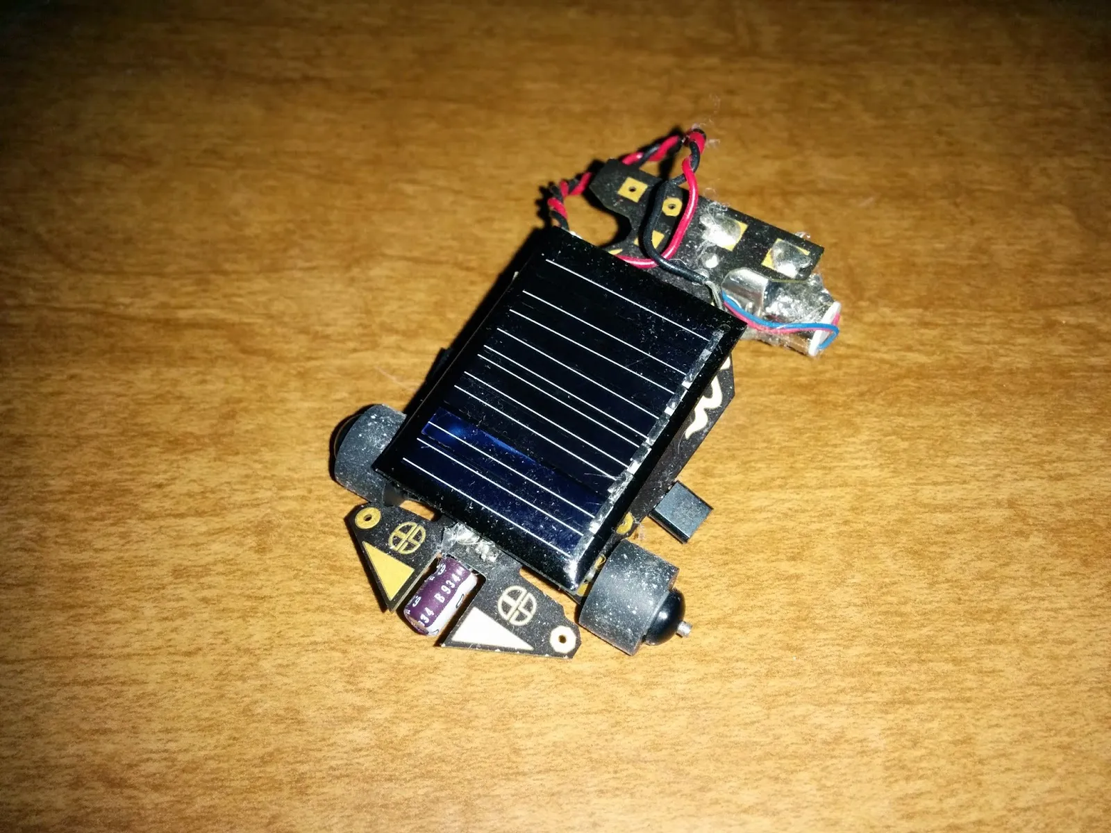The Solar Roller: a Solarbotics Solar Speeder kit car, small solar cell mounted over the PCB chassis.