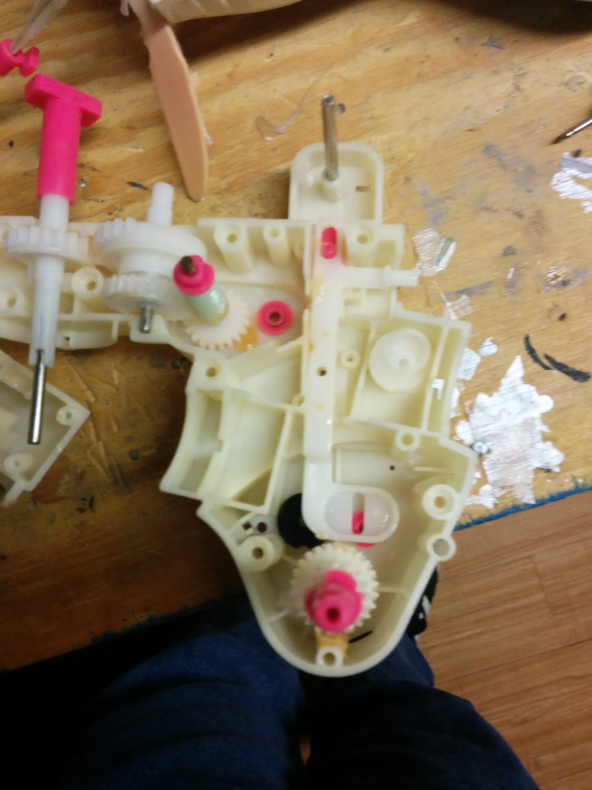 Bubbles' gearbox split open: worm gear and the pink-bushed gear train in the toy's original housing.