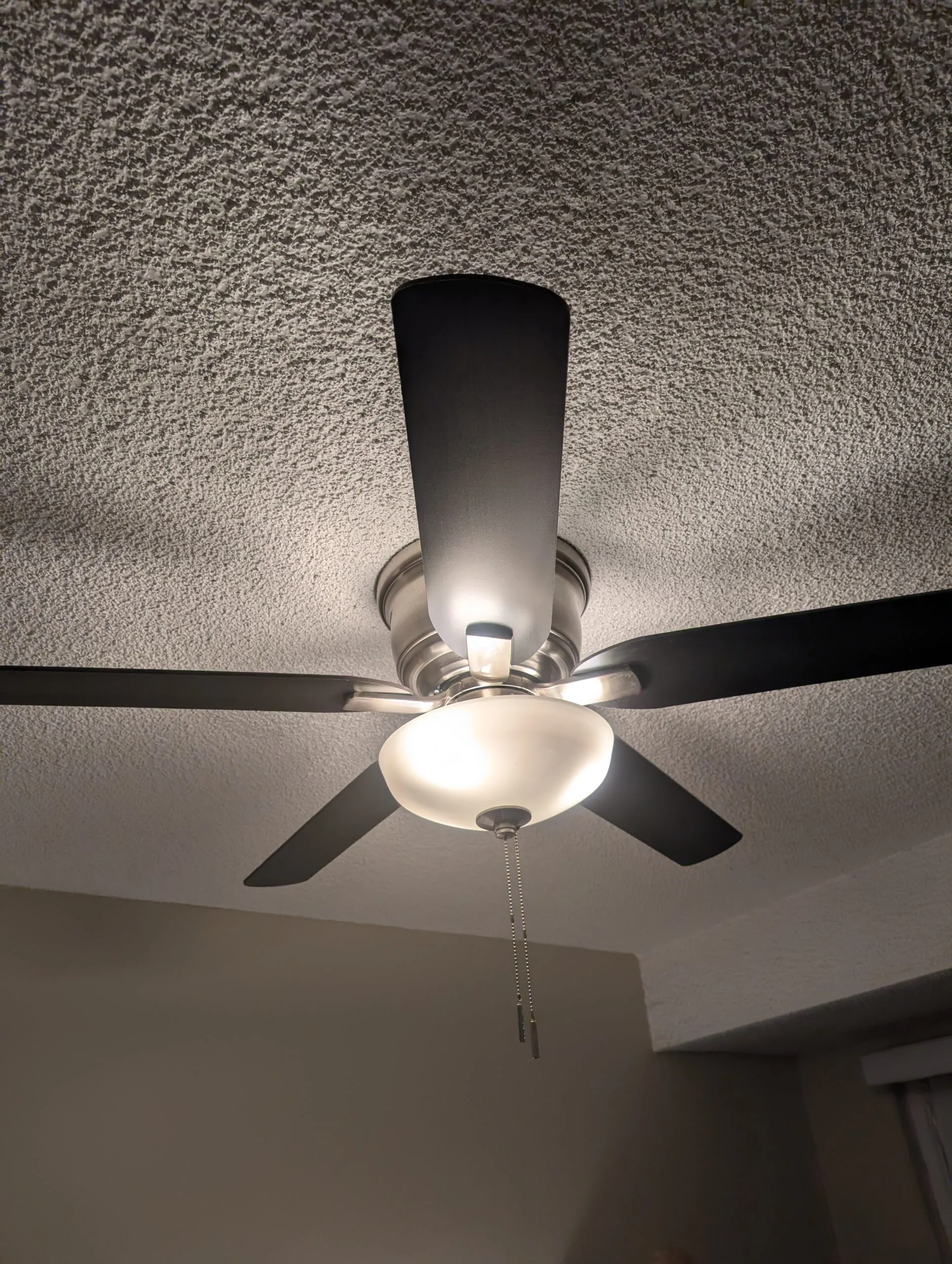 The bedroom ceiling fan, still pull-chain operated.