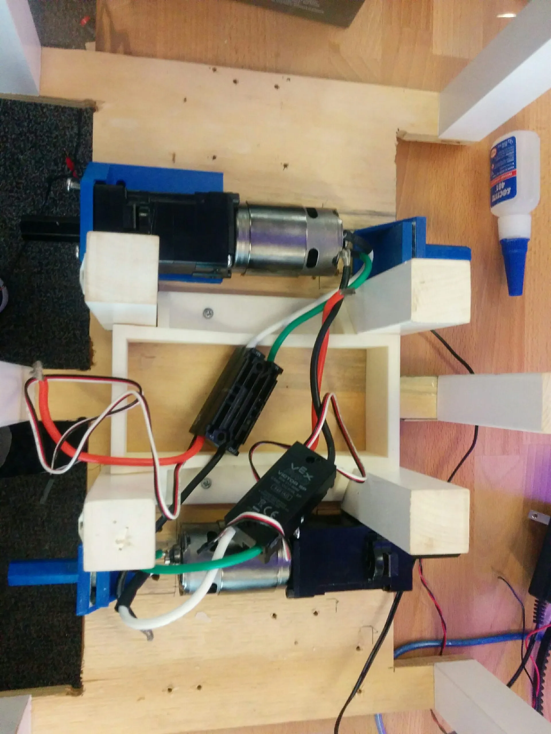 The 2017 drivetrain experiment: DC gearmotors on printed mounts with a VEX Victor SP speed controller.