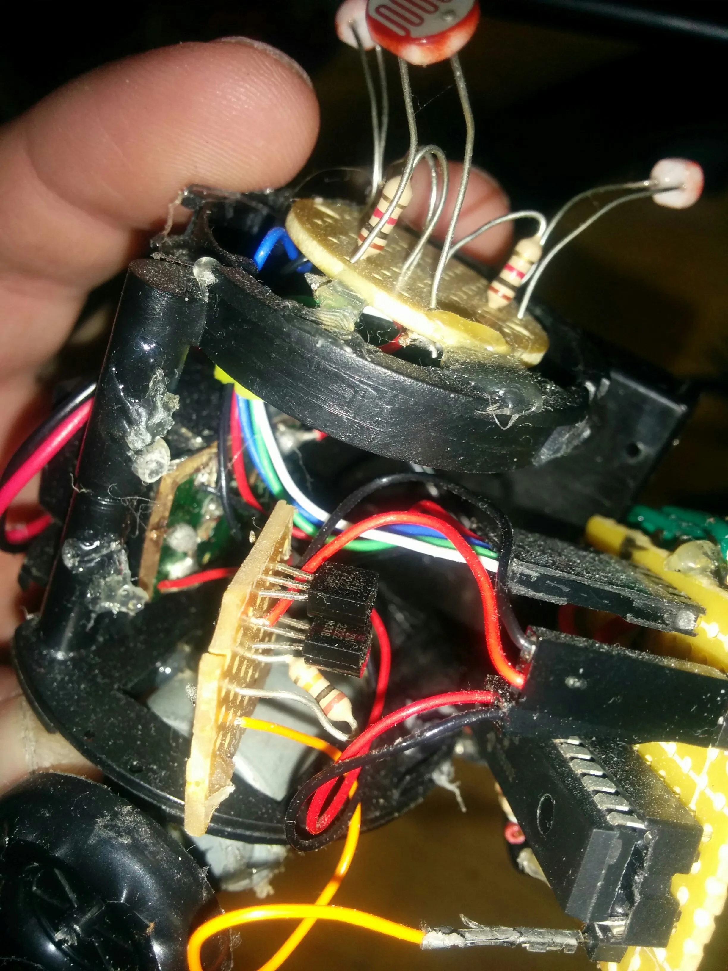 Sensor disc lifted to show the driver transistors and the hot glue holding Triclops together.