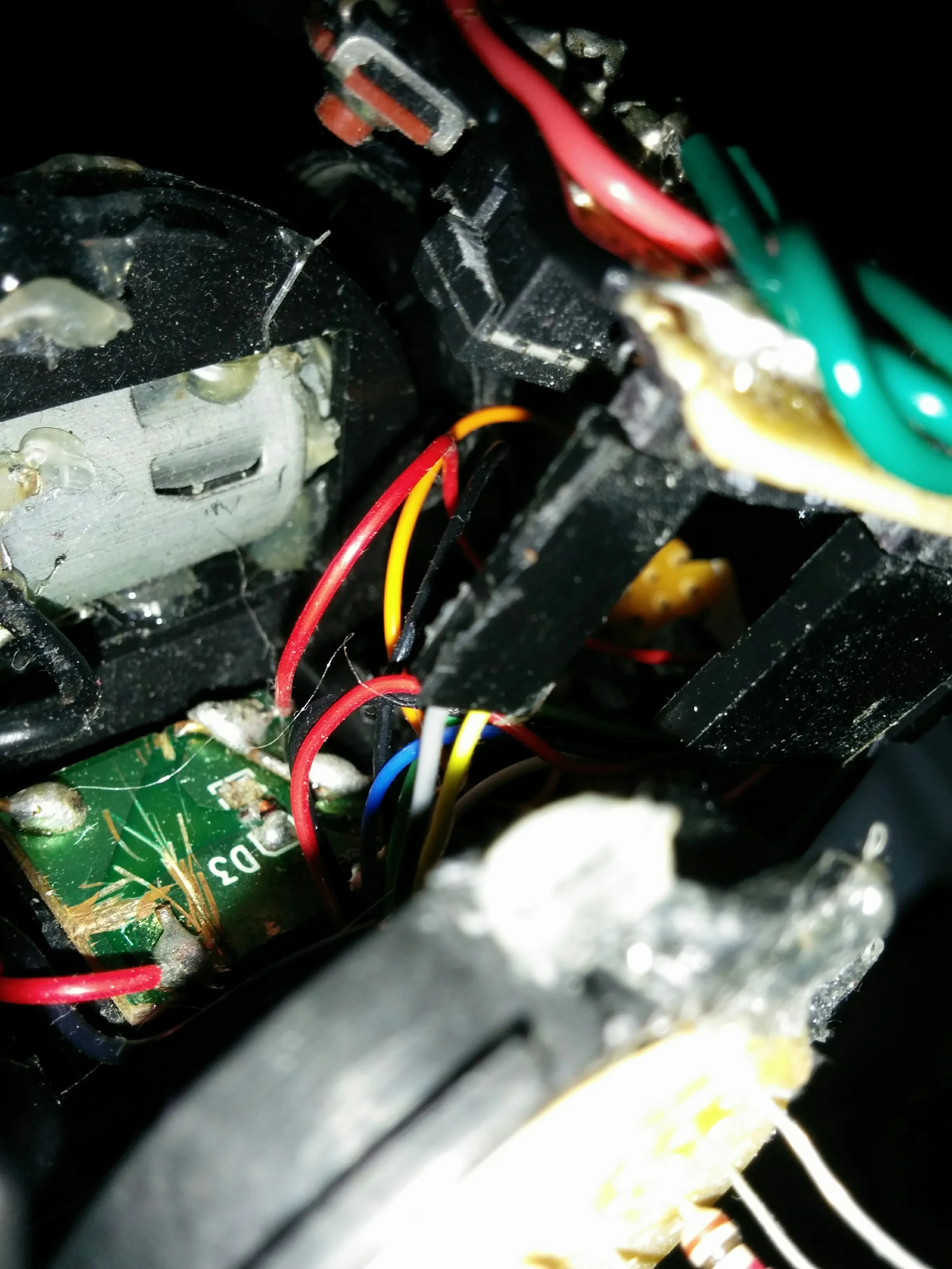Macro into Triclops's guts: motor board, transistor pair, and every color of hookup wire.