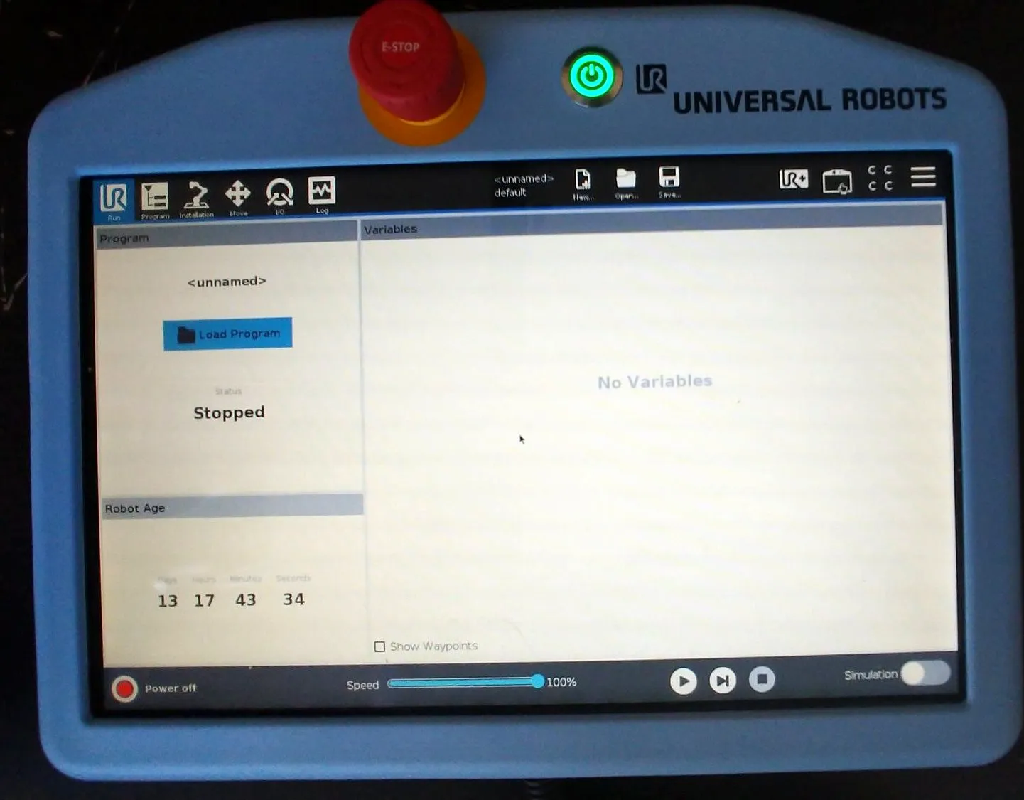 The UR e-Series teach pendant, PolyScope on screen with the program stopped and the speed slider along the bottom.