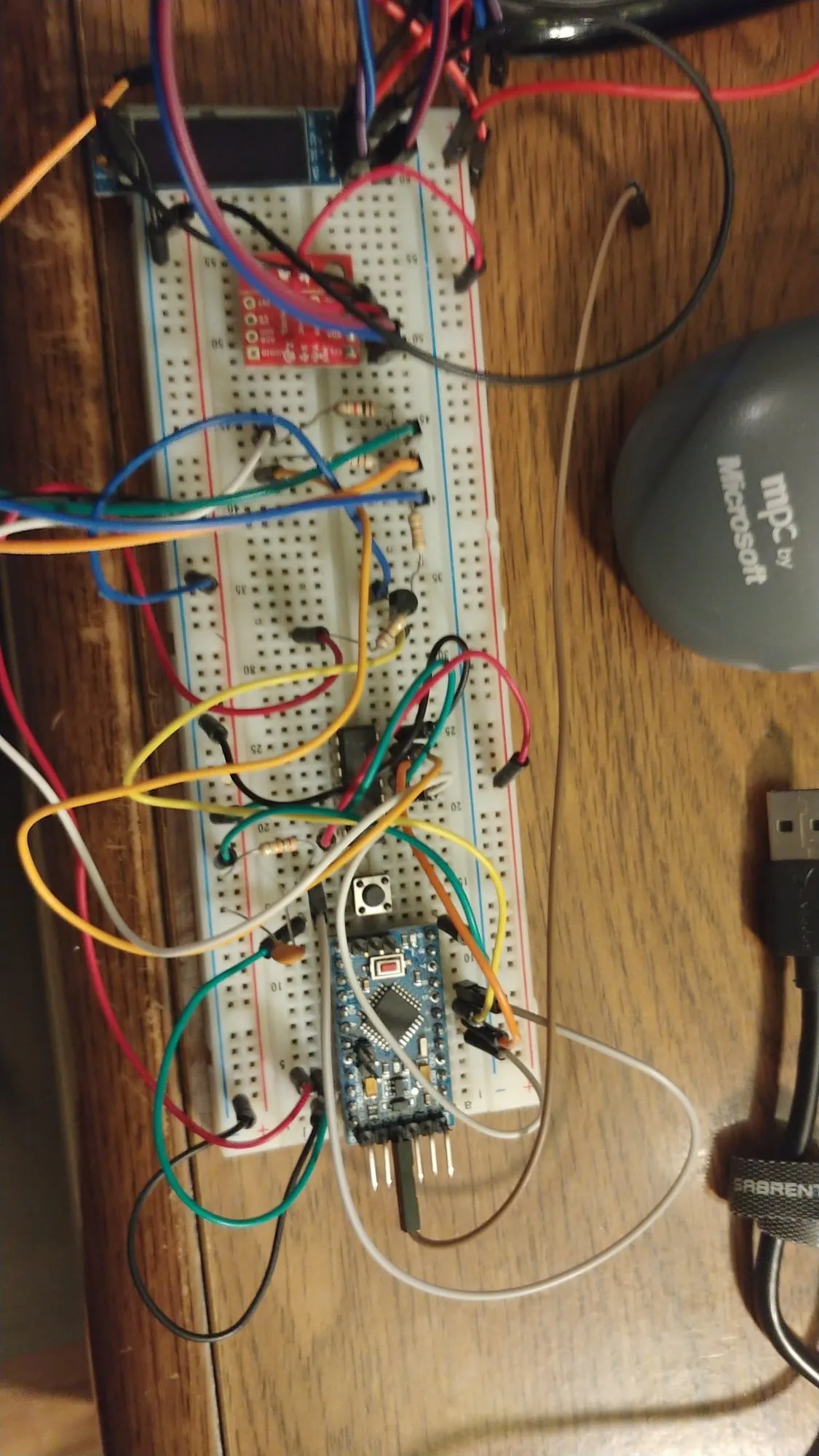 The user interface board sketch on a breadboard, December 2020: an Arduino Pro Mini at the bottom, a small OLED display at the top, and a tangle of jumpers between them.