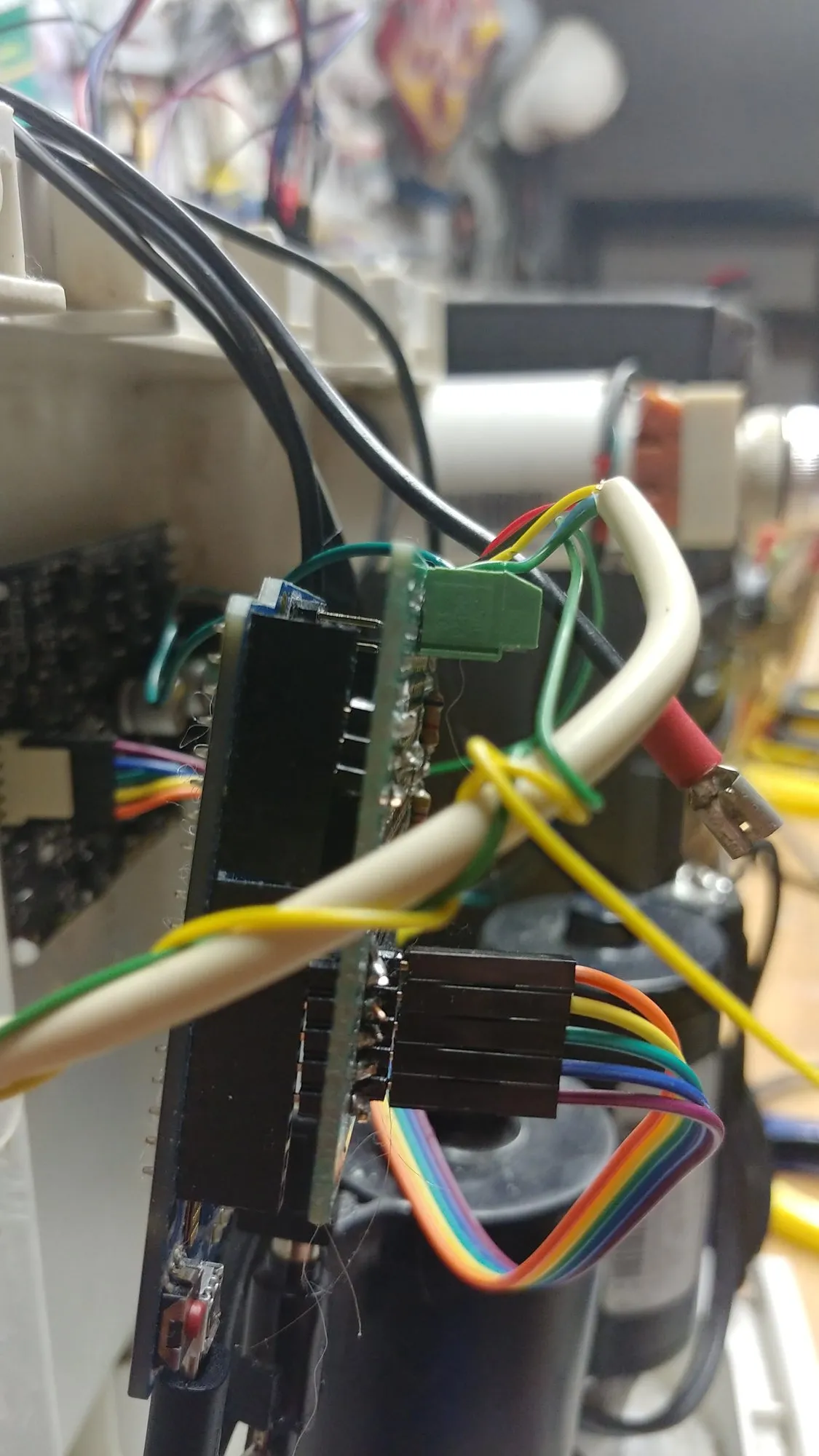 The Leonardo and its interface board seen edge on, ribbon cable and wires still attached.